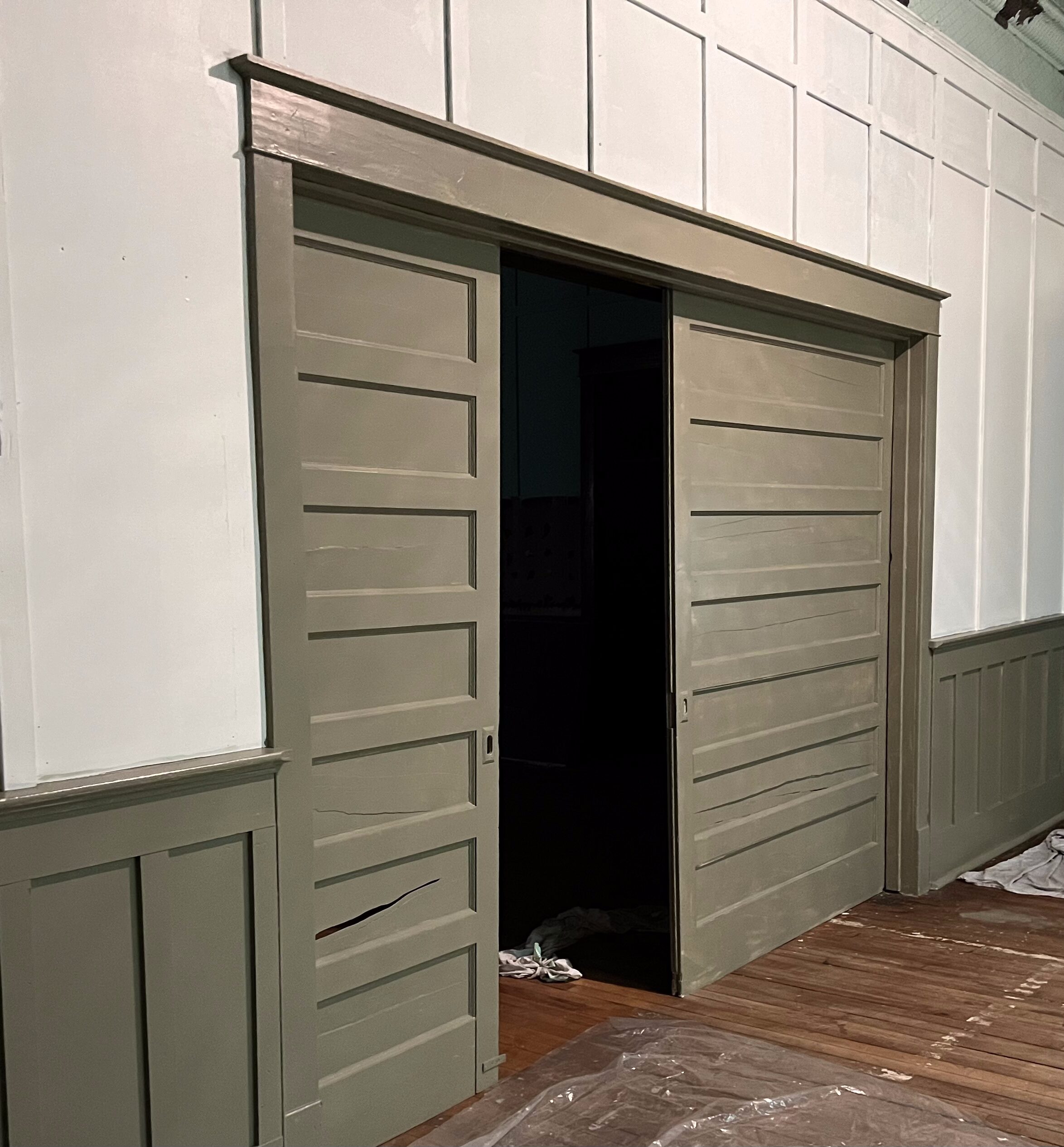 Pocket doors combined with plain geometric trim