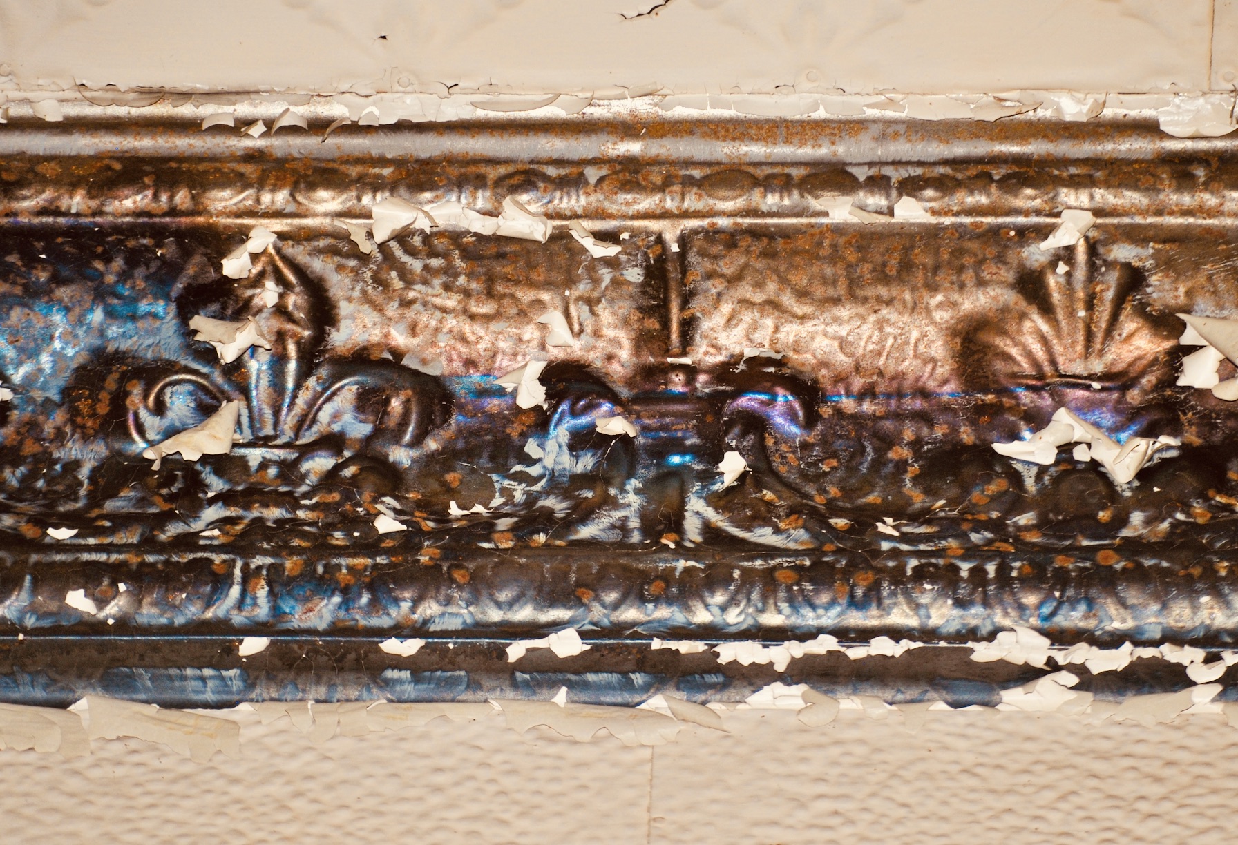 Detail of tin ceiling stamped in the Arts and Crafts Style